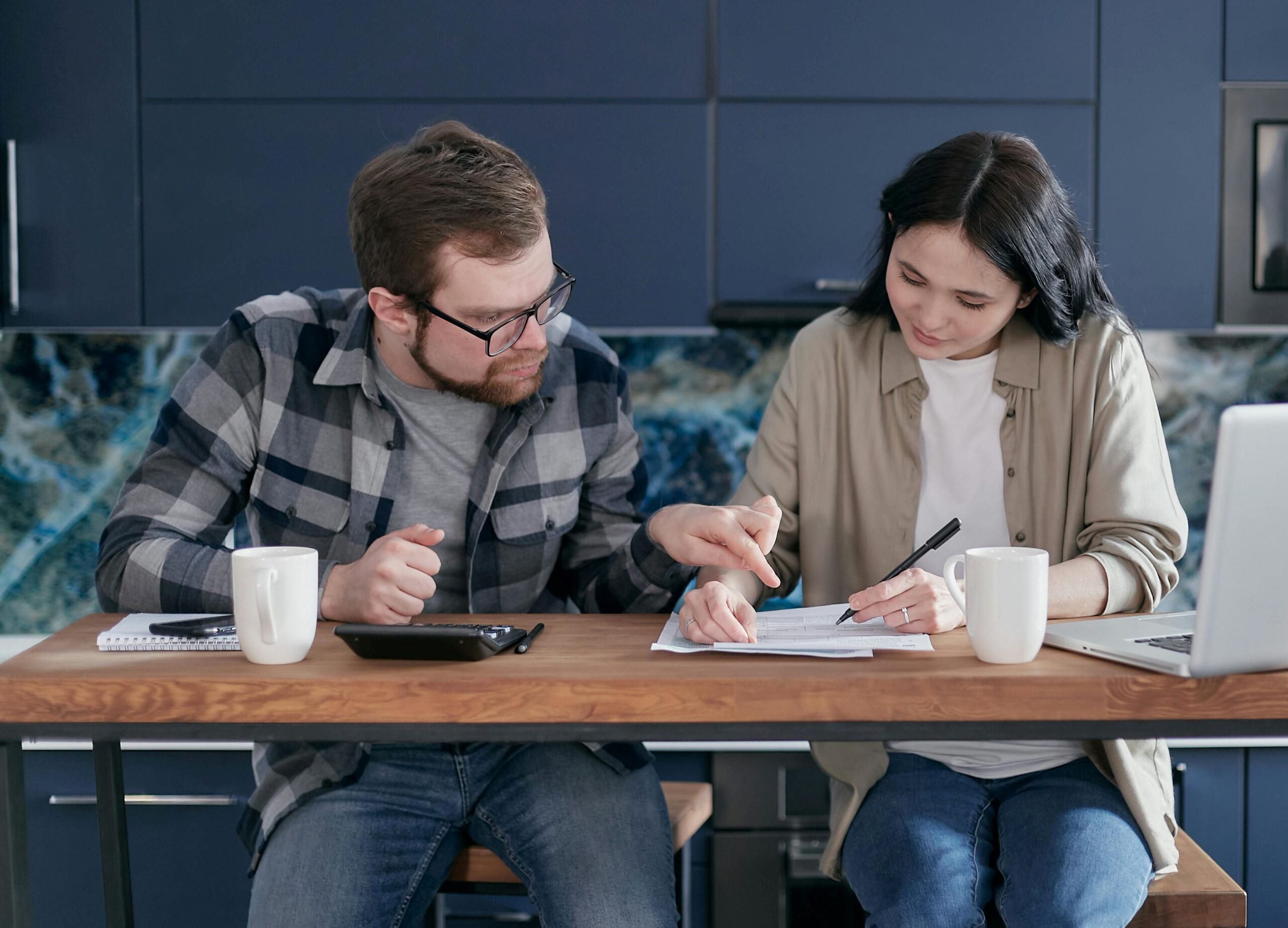 A couple engaged in a discussion over credit bills.