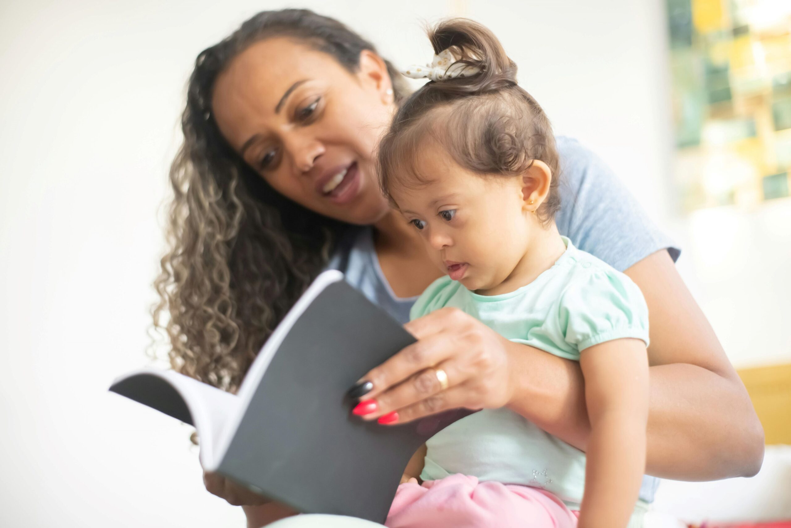 A mother is reading to her small child.