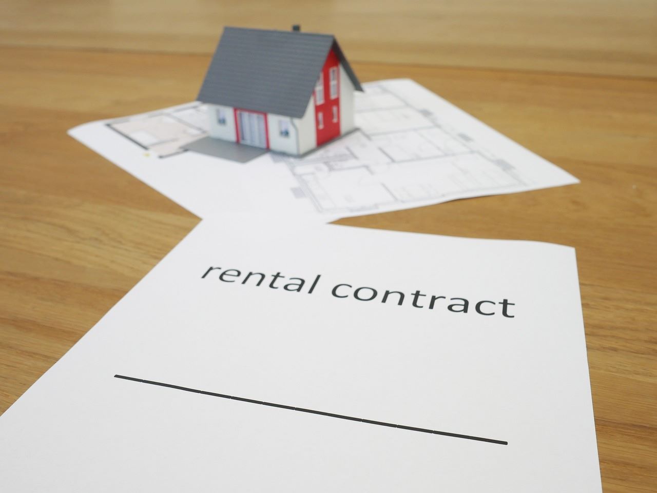 rental contract written on paper—EverLend Mortgage Brokers help first-home buyers start their rentvesting journey.